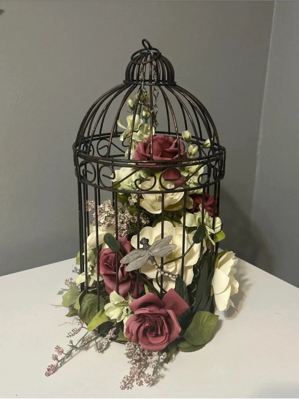 Black Metal Birdcage Floral Centerpiece with Burgundy and Cream Roses